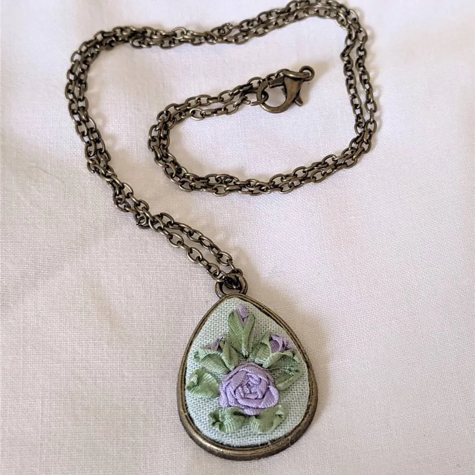 Embroidered roses teardrop pendant