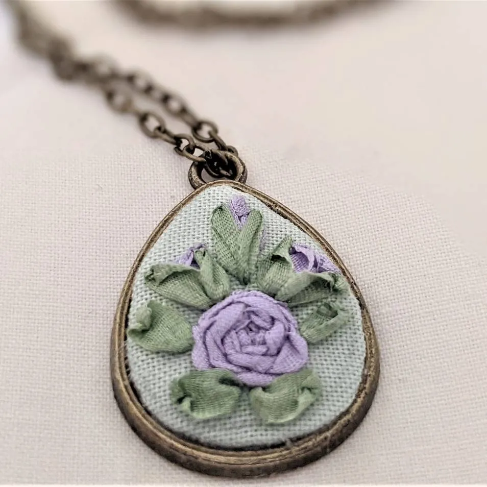 Embroidered roses teardrop pendant