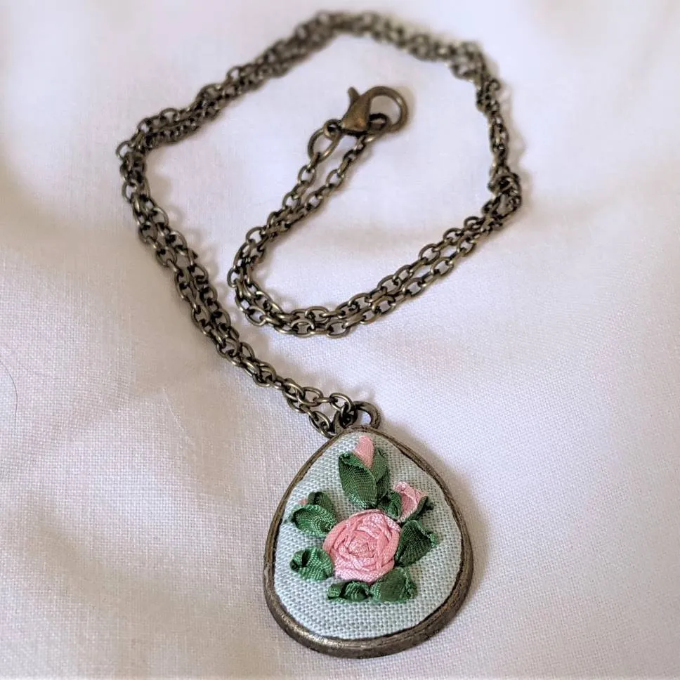 Embroidered roses teardrop pendant